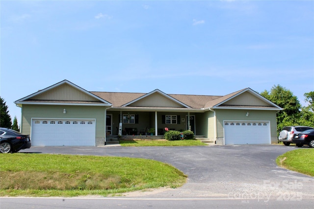 544 Tracy Grove Rd, Flat Rock, NC 28731 - ranch-style house with an attached garage, driveway, a porch, and a front yard