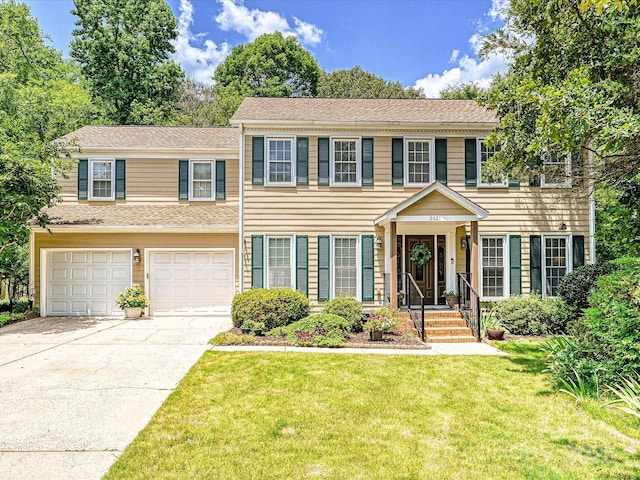 2621 Brightmoor Ridge Dr, Matthews, NC 28105 - colonial home with driveway, a front yard, and an attached garage