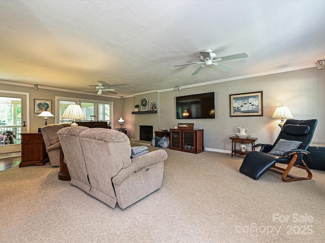 2621 Brightmoor Ridge Dr, Matthews, NC 28105 - carpeted living area featuring a ceiling fan, plenty of natural light, ornamental molding, and a brick fireplace