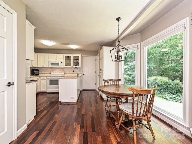 2621 Brightmoor Ridge Dr, Matthews, NC 28105 - dining area with a chandelier and dark wood-type flooring