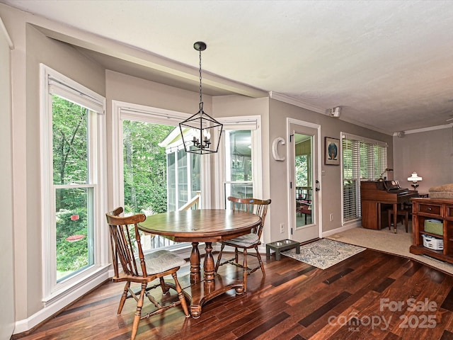 2621 Brightmoor Ridge Dr, Matthews, NC 28105 - dining area featuring wood finished floors, a chandelier, and crown molding