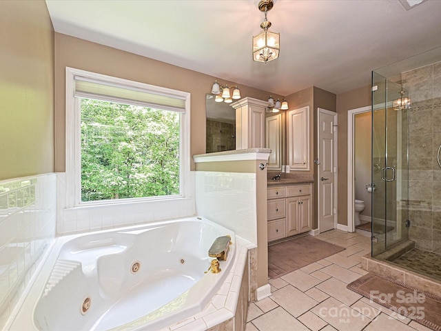 2621 Brightmoor Ridge Dr, Matthews, NC 28105 - full bath with a shower stall, a tub with jets, a chandelier, vanity, and tile patterned floors