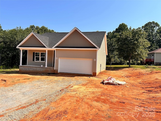 3506 14th Ave SW, Hickory, NC 28602 - view of front facade with driveway, a garage, a porch, and a shingled roof