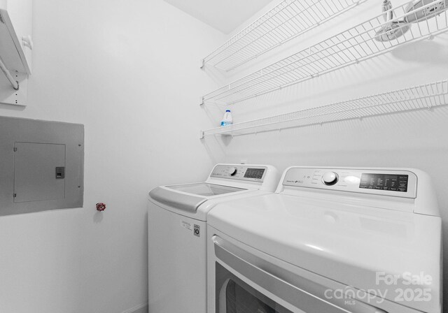 17811 Half Moon Ln Unit E, Cornelius, NC 28031 - washroom with electric panel and washer and clothes dryer