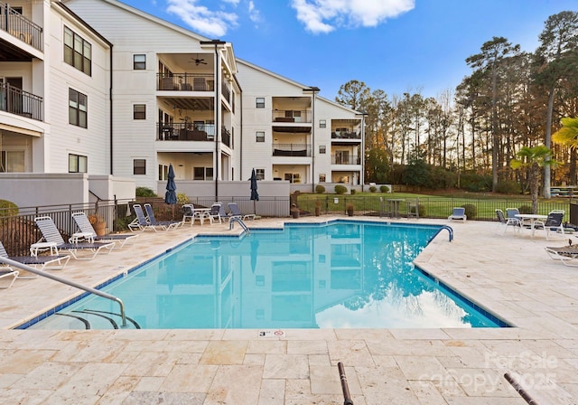 17811 Half Moon Ln Unit E, Cornelius, NC 28031 - community pool featuring a patio area and a ceiling fan