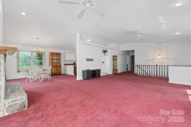 371 Clearview Dr, Waynesville, NC 28786 - carpeted living area featuring a ceiling fan, vaulted ceiling, recessed lighting, and a chandelier