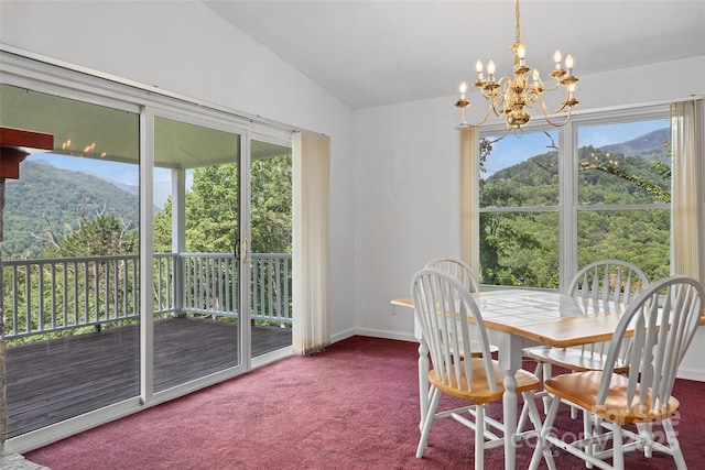 371 Clearview Dr, Waynesville, NC 28786 - carpeted dining area featuring lofted ceiling, a chandelier, and a mountain view