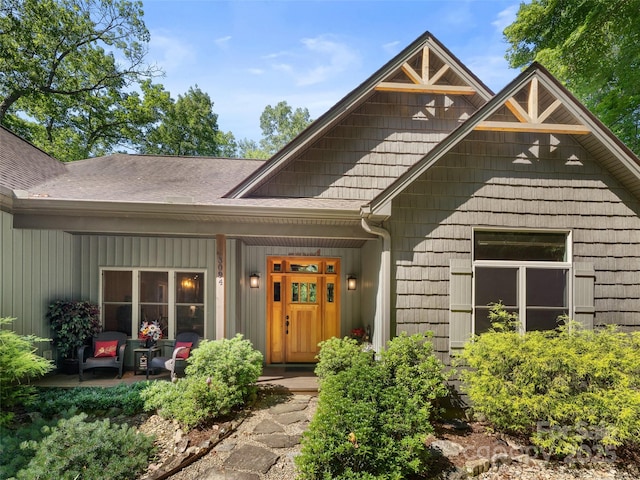 3094 Connestee Trl, Brevard, NC 28712 - view of exterior entry featuring a porch and a shingled roof