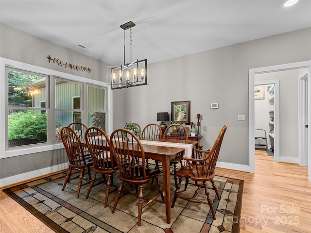 3094 Connestee Trl, Brevard, NC 28712 - dining room featuring light wood-style floors and a chandelier