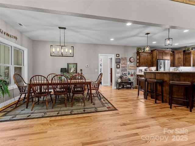 3094 Connestee Trl, Brevard, NC 28712 - dining room featuring light wood-type flooring, recessed lighting, and a chandelier