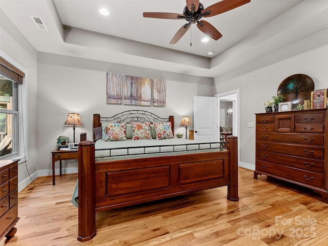 3094 Connestee Trl, Brevard, NC 28712 - bedroom featuring light wood-style flooring, a raised ceiling, and recessed lighting