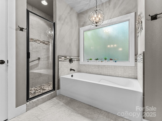 3094 Connestee Trl, Brevard, NC 28712 - bathroom with a garden tub, a stall shower, and a chandelier