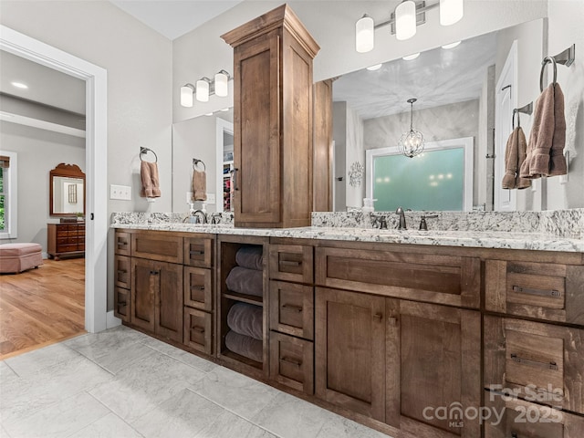 3094 Connestee Trl, Brevard, NC 28712 - bathroom featuring double vanity and a chandelier