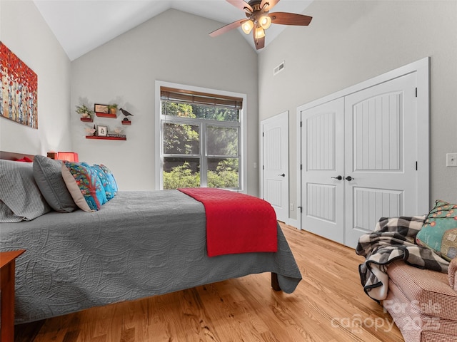 3094 Connestee Trl, Brevard, NC 28712 - bedroom featuring wood finished floors, vaulted ceiling, a ceiling fan, and a closet