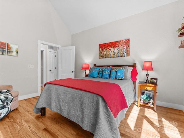 3094 Connestee Trl, Brevard, NC 28712 - bedroom with high vaulted ceiling and wood finished floors