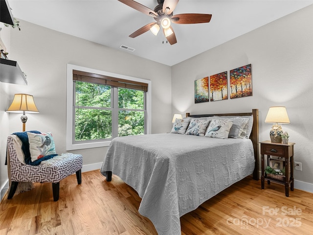 3094 Connestee Trl, Brevard, NC 28712 - bedroom with wood finished floors and a ceiling fan