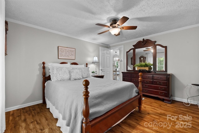 4534 Pebblebrook Cir SW, Concord, NC 28027 - bedroom with wood finished floors, a textured ceiling, ceiling fan, and crown molding