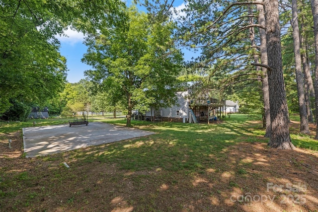 4534 Pebblebrook Cir SW, Concord, NC 28027 - view of grassy yard featuring stairs and a wooden deck