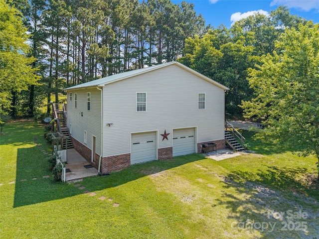 4534 Pebblebrook Cir SW, Concord, NC 28027 - view of home's exterior featuring stairs, a yard, driveway, and an attached garage