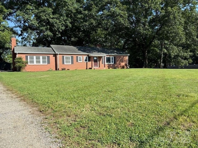 148 Barium Ln, Statesville, NC 28677 - single story home featuring a chimney, a front lawn, and brick siding