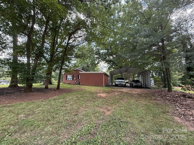 148 Barium Ln, Statesville, NC 28677 - view of grassy yard with a detached carport and driveway