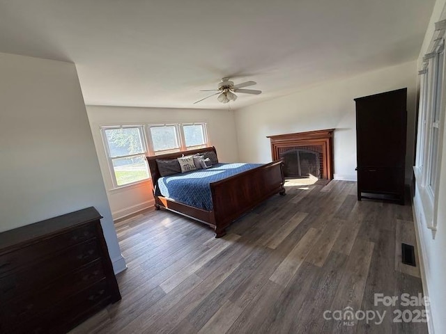 148 Barium Ln, Statesville, NC 28677 - bedroom featuring dark wood-style flooring, a fireplace, and ceiling fan