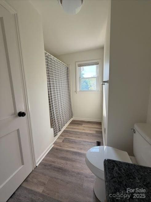 148 Barium Ln, Statesville, NC 28677 - full bath featuring wood finished floors and a shower with shower curtain