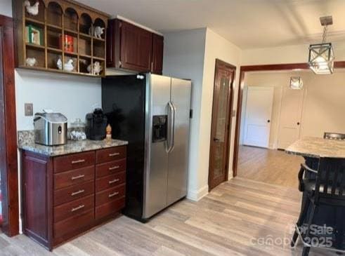 148 Barium Ln, Statesville, NC 28677 - kitchen featuring stainless steel refrigerator with ice dispenser, light wood-style floors, decorative light fixtures, and light stone countertops