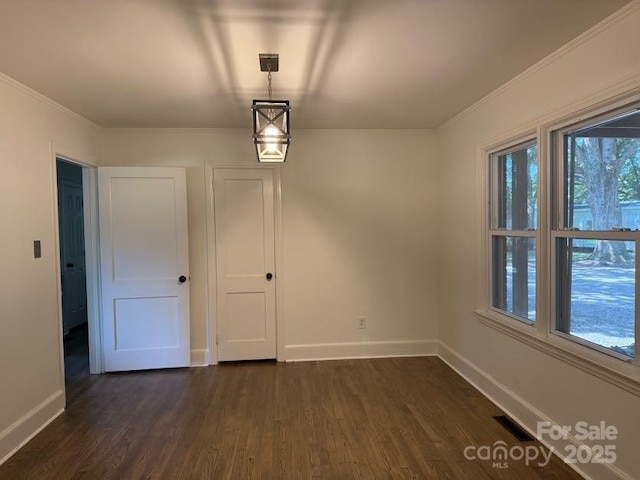 148 Barium Ln, Statesville, NC 28677 - unfurnished dining area featuring dark wood-style flooring and ornamental molding