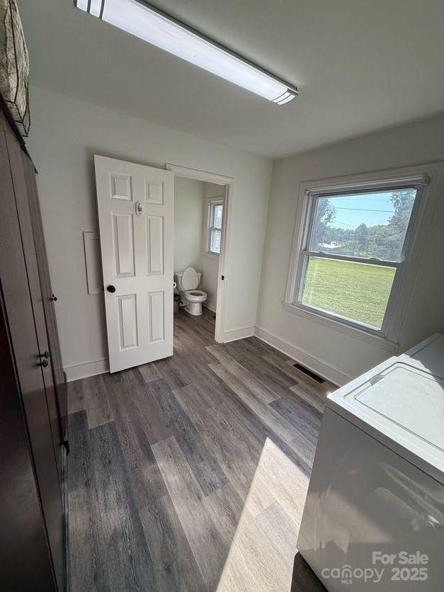 148 Barium Ln, Statesville, NC 28677 - unfurnished bedroom with dark wood-style flooring and washer / clothes dryer
