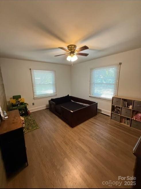 148 Barium Ln, Statesville, NC 28677 - bedroom with wood finished floors, multiple windows, and a ceiling fan