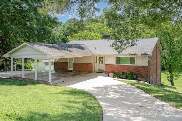 301 Rosemont Ave SE, Concord, NC 28025 - single story home featuring brick siding, a storage shed, concrete driveway, a front lawn, and a chimney