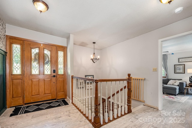 301 Rosemont Ave SE, Concord, NC 28025 - entryway with light wood-style flooring and a chandelier
