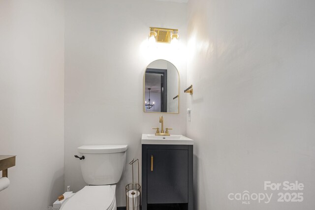 301 Rosemont Ave SE, Concord, NC 28025 - half bath featuring vanity and toilet