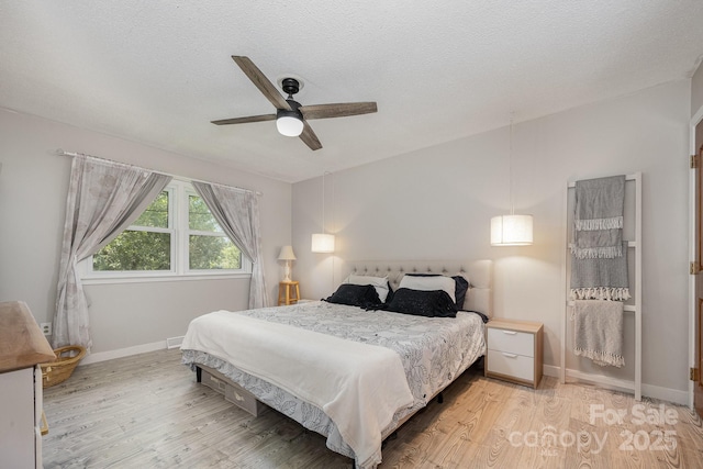 301 Rosemont Ave SE, Concord, NC 28025 - bedroom with light wood finished floors and ceiling fan