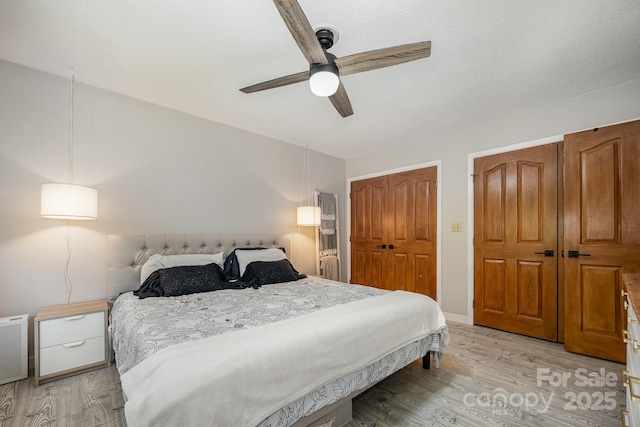301 Rosemont Ave SE, Concord, NC 28025 - bedroom featuring light wood-style floors, ceiling fan, and a closet