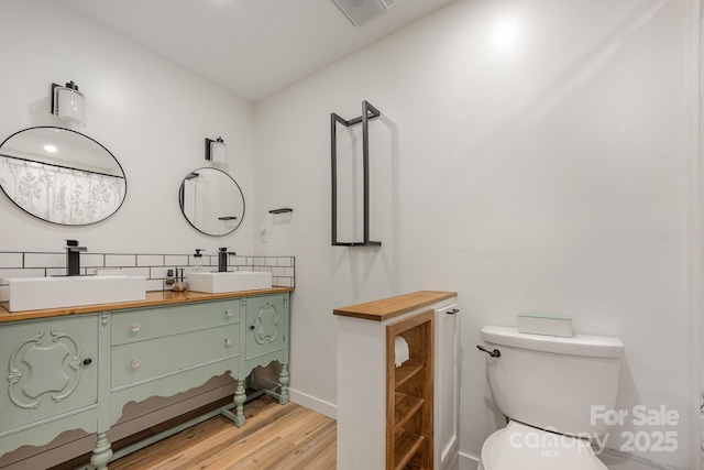 301 Rosemont Ave SE, Concord, NC 28025 - full bath featuring double vanity and wood finished floors