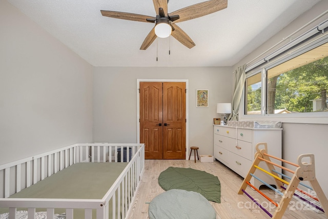 301 Rosemont Ave SE, Concord, NC 28025 - bedroom with light wood-style floors and ceiling fan