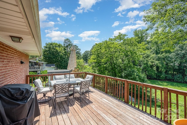 301 Rosemont Ave SE, Concord, NC 28025 - wooden deck featuring outdoor dining space, grilling area, and a lawn