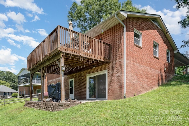 301 Rosemont Ave SE, Concord, NC 28025 - back of property with brick siding, a lawn, and a deck