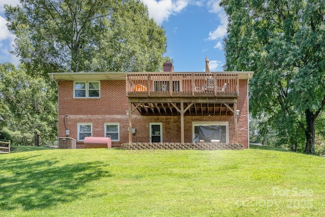 301 Rosemont Ave SE, Concord, NC 28025 - back of property featuring a lawn, brick siding, a wooden deck, and a chimney