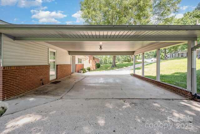 301 Rosemont Ave SE, Concord, NC 28025 - view of vehicle parking featuring driveway and an attached carport