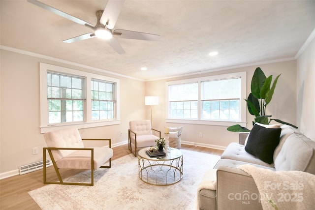 80 Sumner Ave NW, Concord, NC 28027 - living area featuring wood finished floors, a ceiling fan, crown molding, and recessed lighting