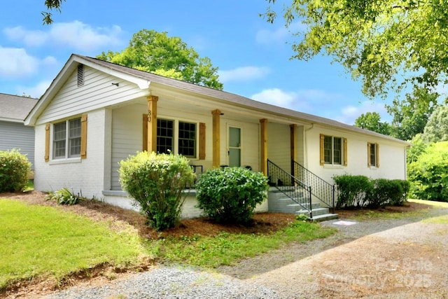 80 Sumner Ave NW, Concord, NC 28027 - ranch-style home with a porch and brick siding
