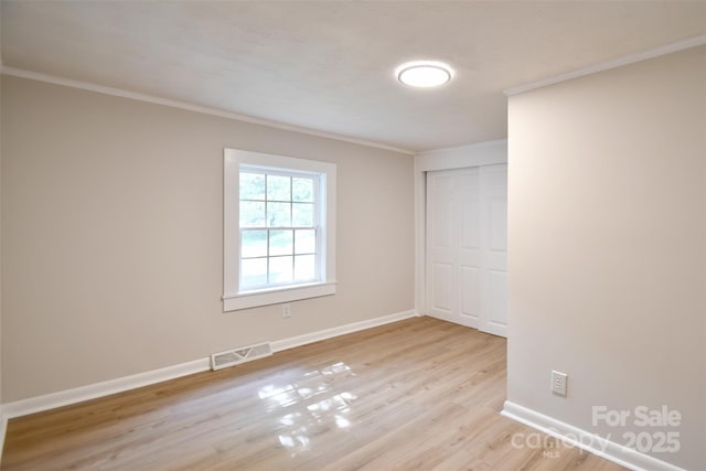 80 Sumner Ave NW, Concord, NC 28027 - empty room with ornamental molding and wood finished floors