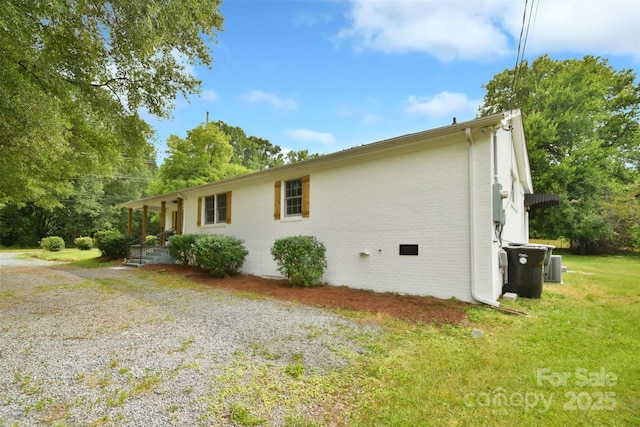 80 Sumner Ave NW, Concord, NC 28027 - view of side of property featuring brick siding and a yard