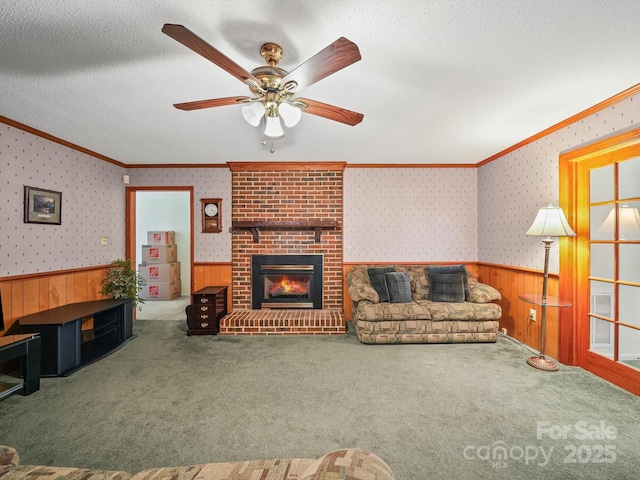 1302 Hawthorne Rd, Lancaster, SC 29720 - carpeted living room with ornamental molding, a wainscoted wall, ceiling fan, wood walls, and wallpapered walls