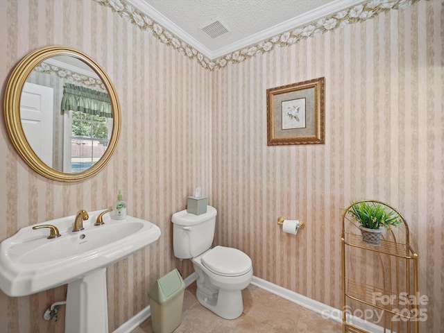 1302 Hawthorne Rd, Lancaster, SC 29720 - bathroom featuring a textured ceiling, tile patterned flooring, wallpapered walls, and ornamental molding