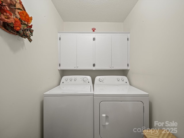 1302 Hawthorne Rd, Lancaster, SC 29720 - laundry room with washing machine and dryer, cabinet space, and a textured ceiling