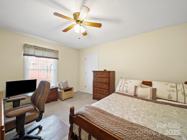 1302 Hawthorne Rd, Lancaster, SC 29720 - bedroom with light carpet, a desk, a ceiling fan, and a textured ceiling